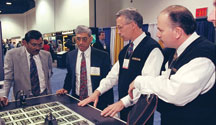 On the show floor at IPC Printed Circuits Expo 1999. Click on the picture for a larger image.