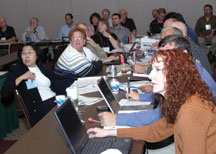 Theresa Rowe, AAI (front) at a standards development committee meeting at the IPC shows. Click on the picture for a larger image.