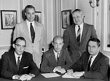 Seated: Al Hughes, Electralab; Robert Swiggett, Photocircuits; William McGinley, Methode. Standing: Dick Zens, Printed Electronics Corporation; and Carl Clayton, Tingstol. Also in attendance at this initial meeting: Ray Pritchard, thereafter named the Executive Director of IPC; Gene Jones, Printed Electronics Corporation; and George Hart and Stewart Fansteel, Graphik Circuits Division of United Carr.