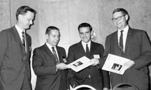 Key contributors to the Component Mounting Handbook. Left to right, Hank Koons, Bell Labs; John DeVore, General Electric; Bert Isaacson, Electralab; and Bob Wathen, Fairchild. Co-chairman Dominick Dellisante, Picatinny Arsenal, is not shown.