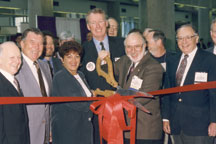  Ribbon cutting at IPC Printed Circuits Expo. Don Redfern, Insulectro (center), with Bonnie Fena, Hibbing Electronics Corp. (left) and astronaut Wally Schirra, Peter Sarmanian, Printed Circuit Corp., and Sam Altschuler, Altron Incorporated (right). Click on the picture for a larger image.