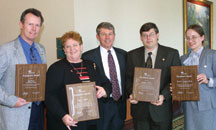 Four individuals were presented with President's Awards for their dedication to IPC and the industry. From left to right, Jeff Ferry, Circuit Technology Center, Inc.; Peggi Blakley, NSWC - Crane; IPC President Denny McGuirk, Daniel Foster, Soldering Technology International; and Karen Tellefsen, Alpha Metals.